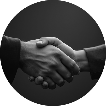 Two business professionals shaking hands representing trust and client partnership at Luna360 Media